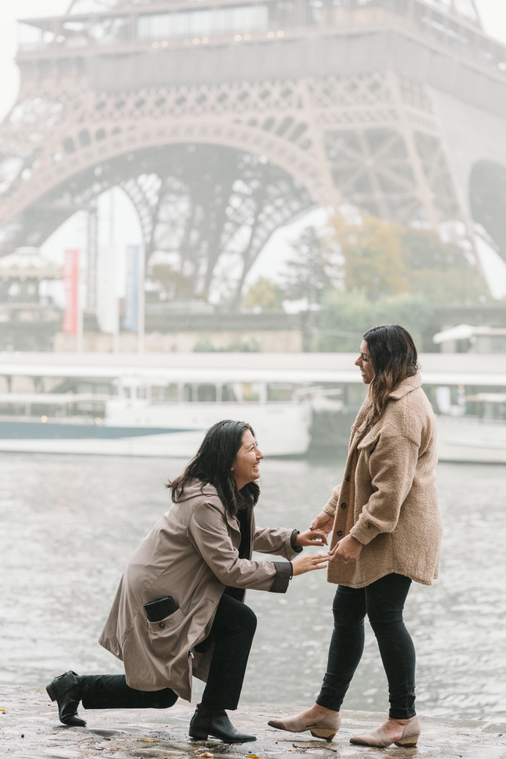 two women get engaged at the eiffel tower in paris