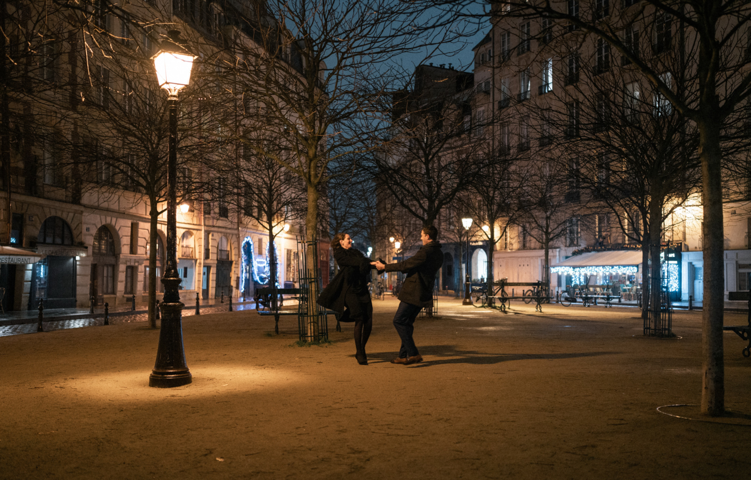 newly engaged couple dance in place dauphine in paris