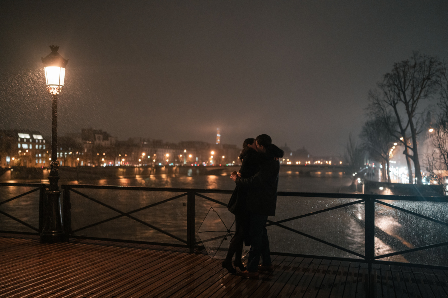 newly engaged couple kiss passionately after proposal in paris