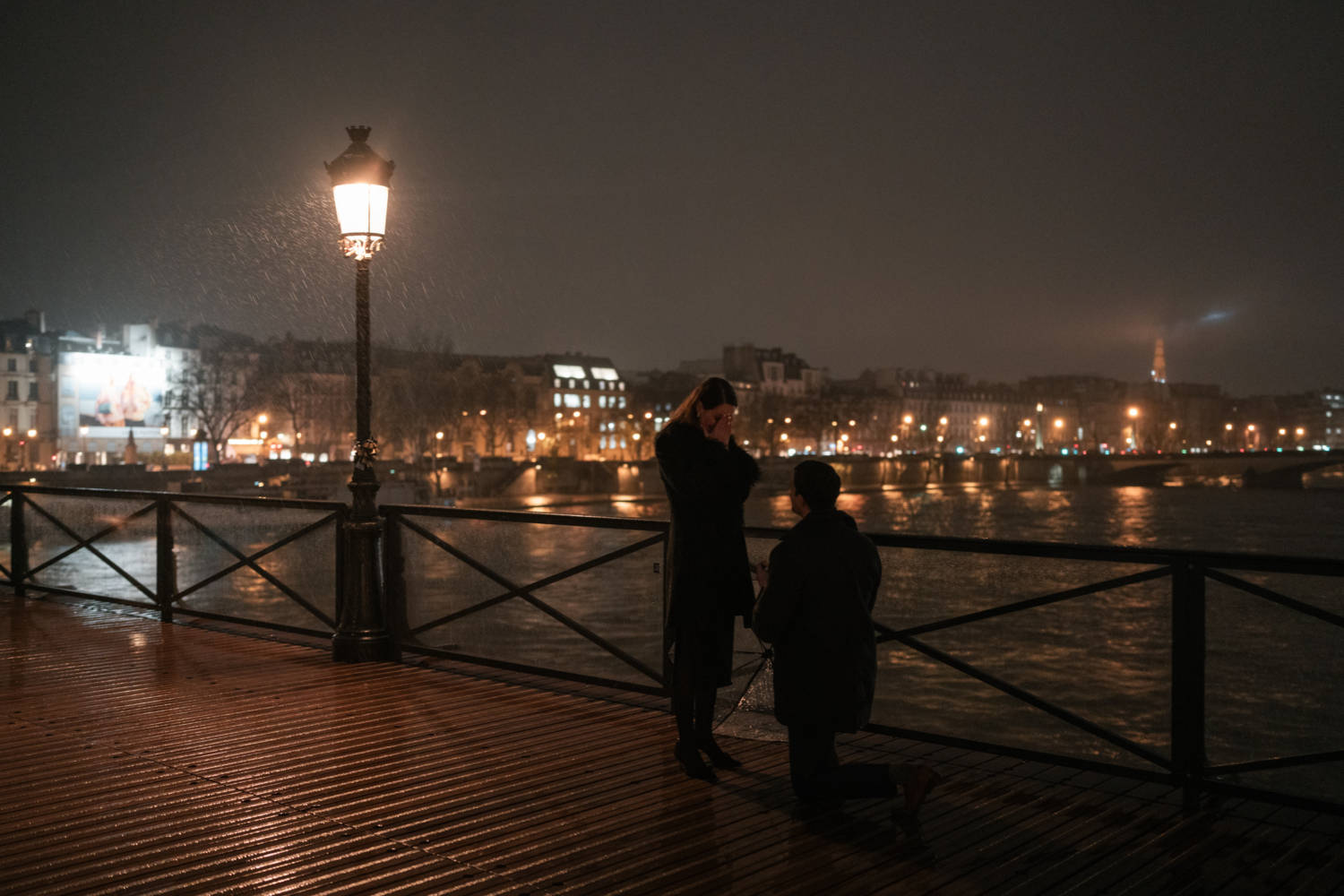 woman is shocked as man on one knee in paris proposes marriage