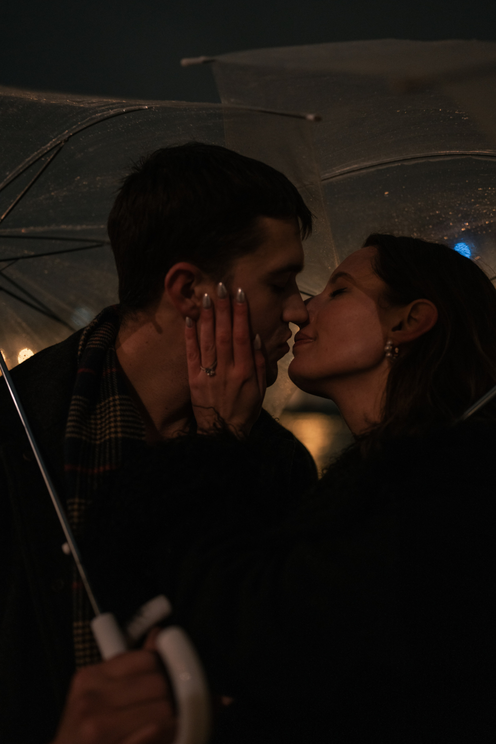 romantic and passionate couple in the rain in paris