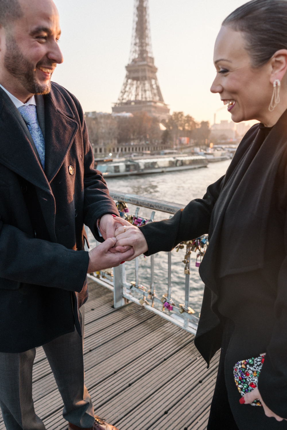 newly engaged couple share a laugh after their engagement in paris