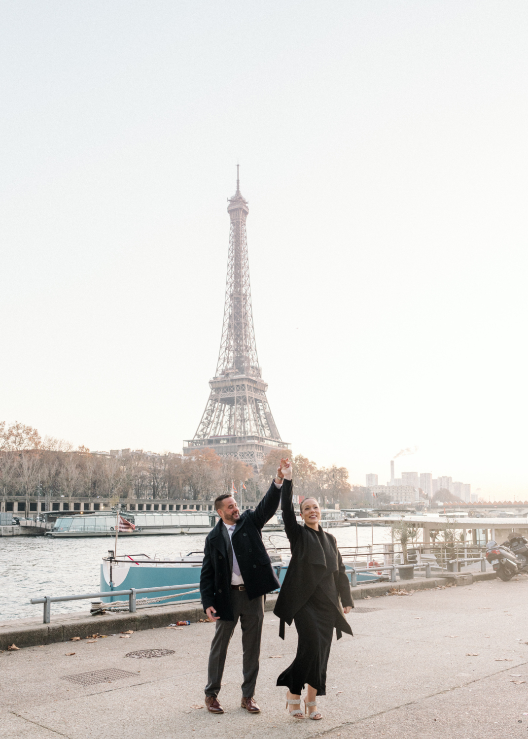 newly engaged mature couple dance near the eiffel tower in paris