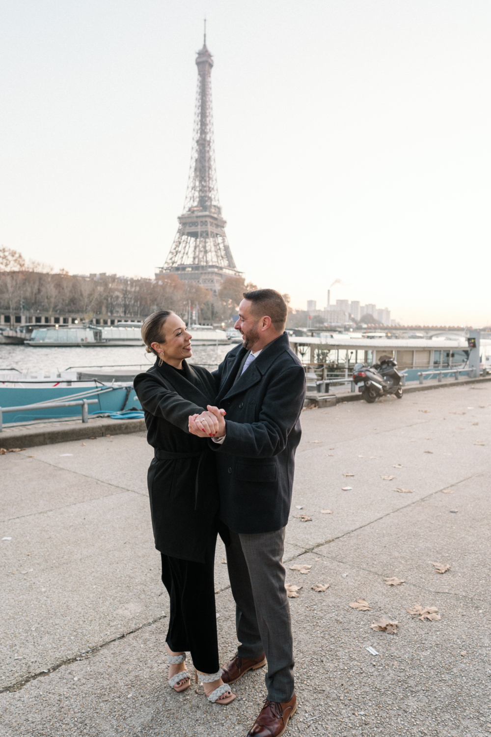 newly engaged mature couple dance in paris