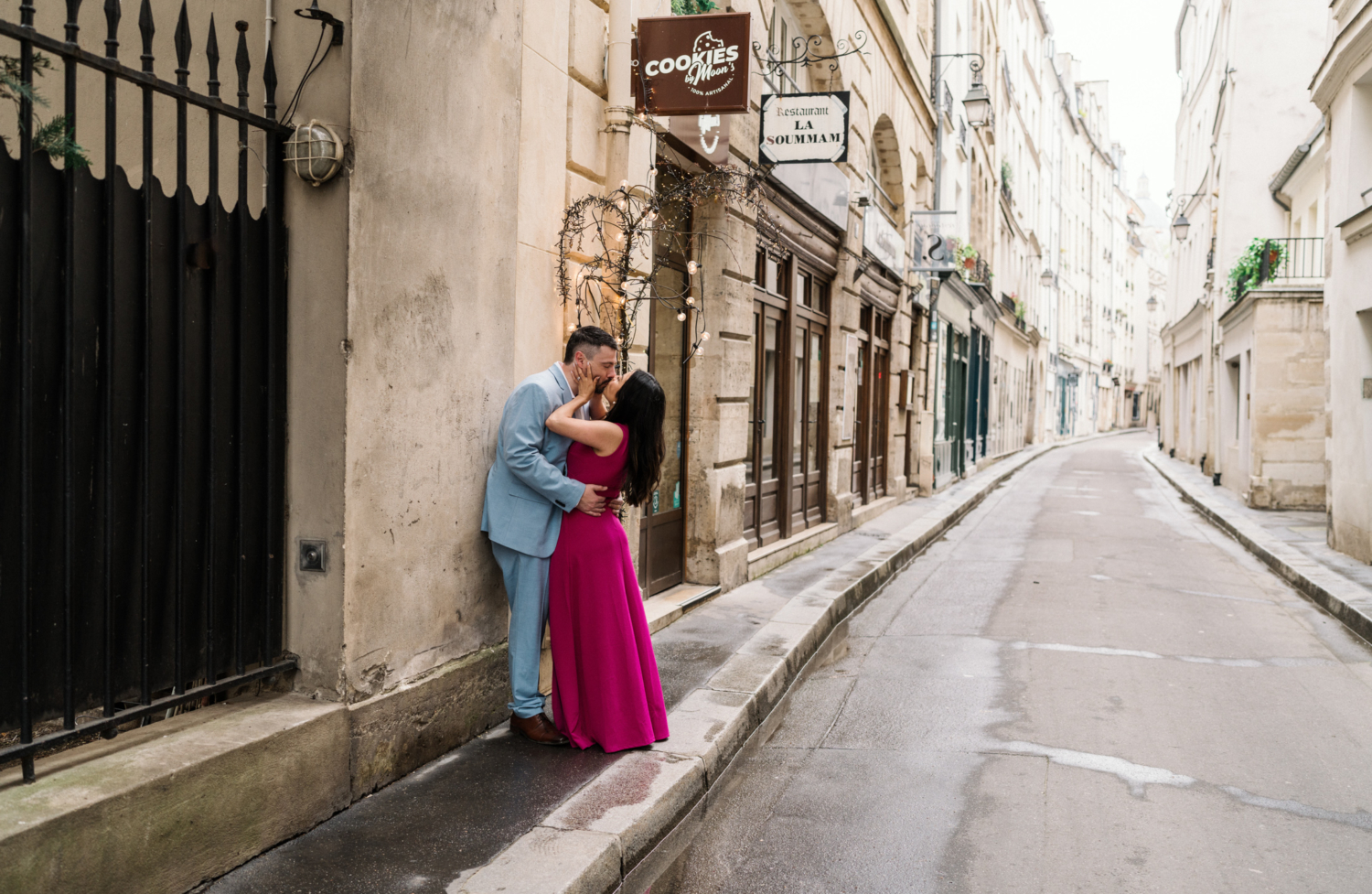 couple passionately kiss on charming paris street