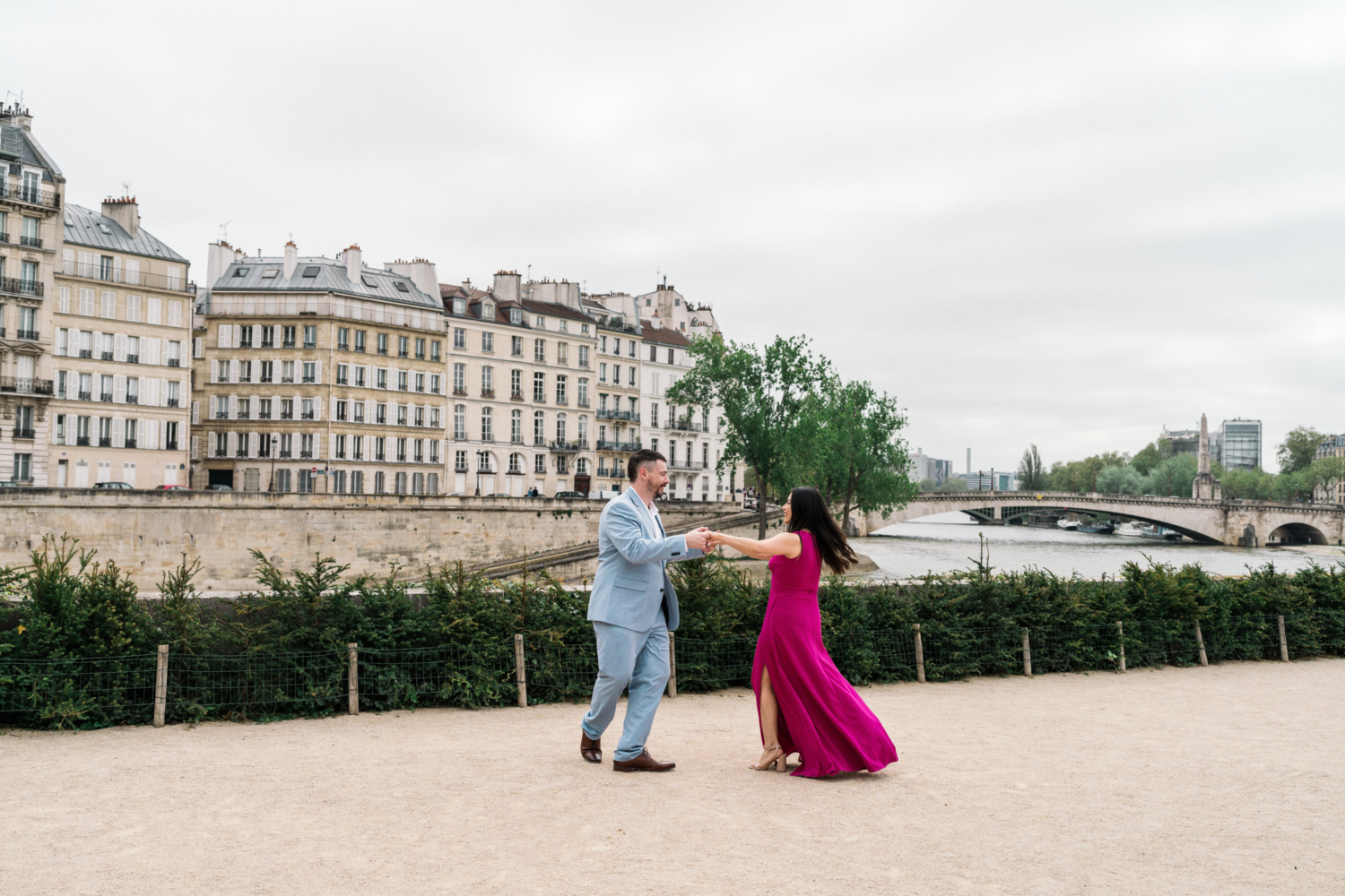 husband and wife dance in charming neighborhood in paris