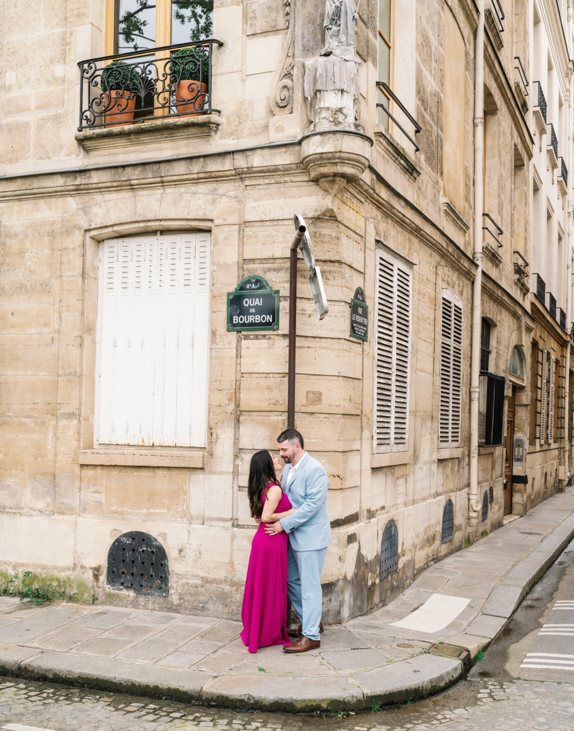 beautiful couple embrace on charming street in paris france