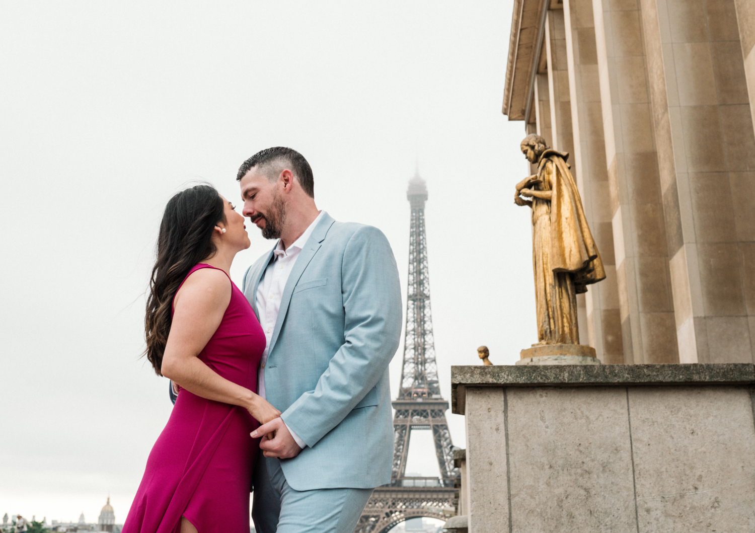 beautiful couple embrace with view of eiffel tower in paris