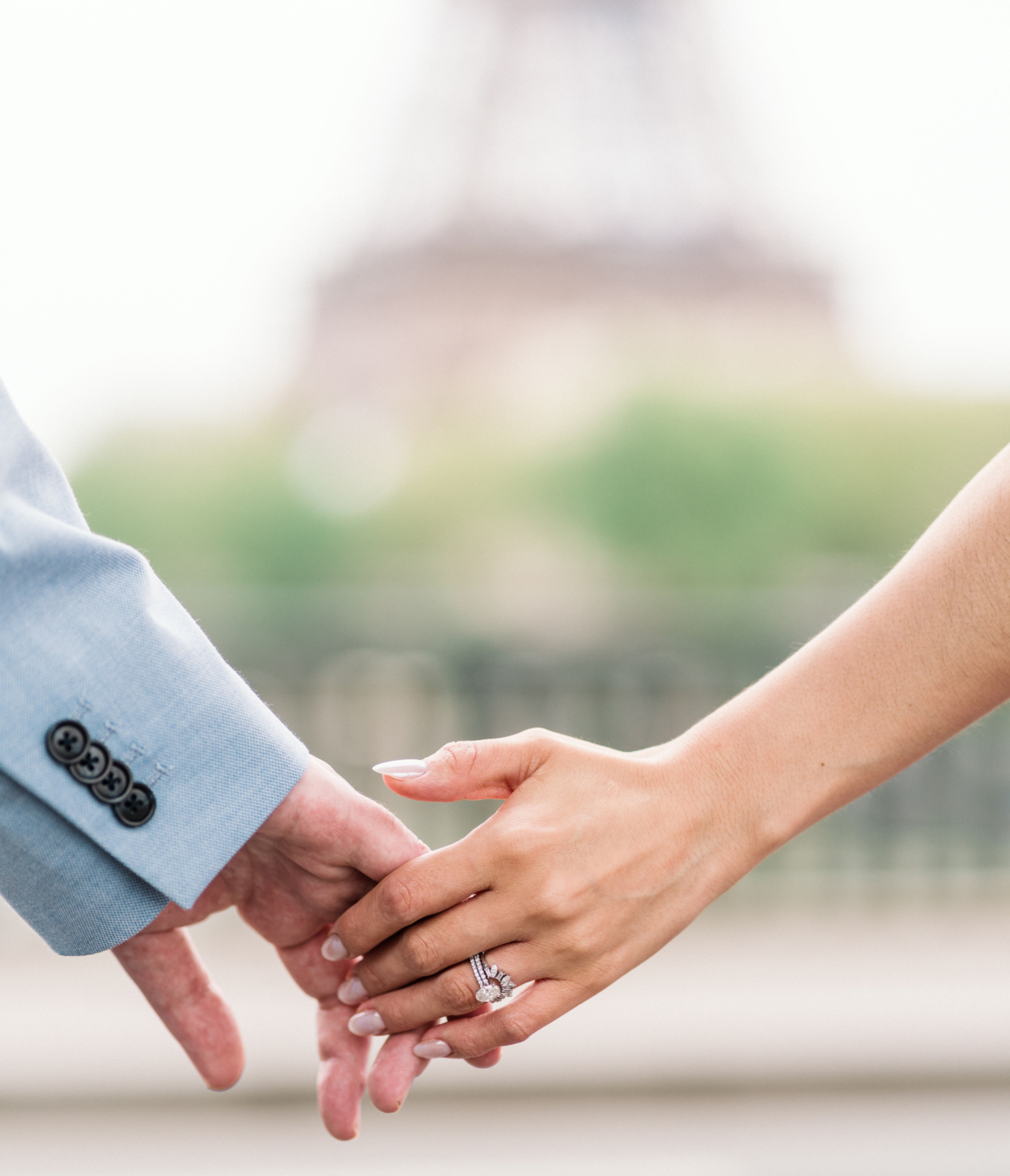 husband and wife show wedding rings in paris