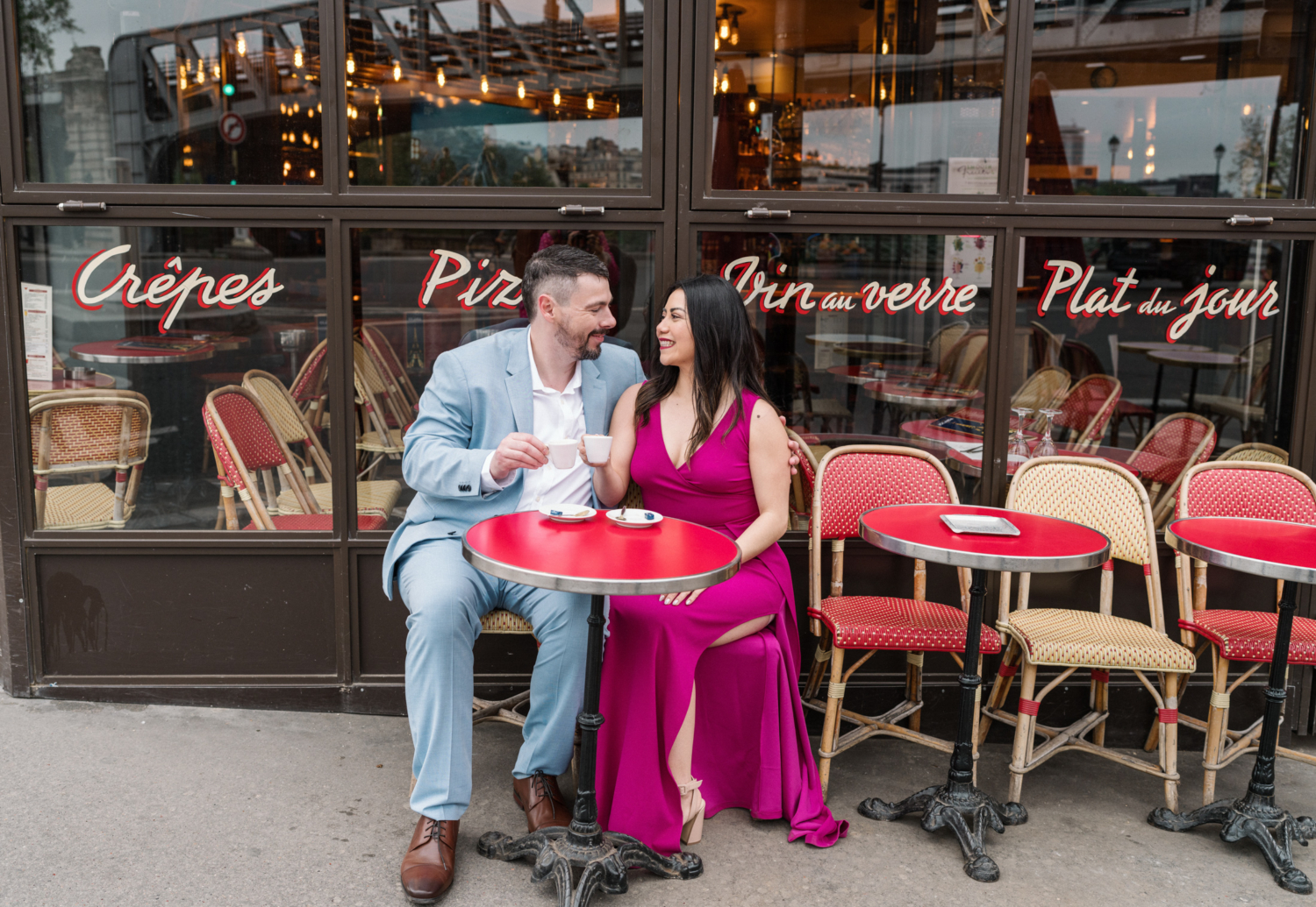 cute couple toast each other with coffee at paris cafe