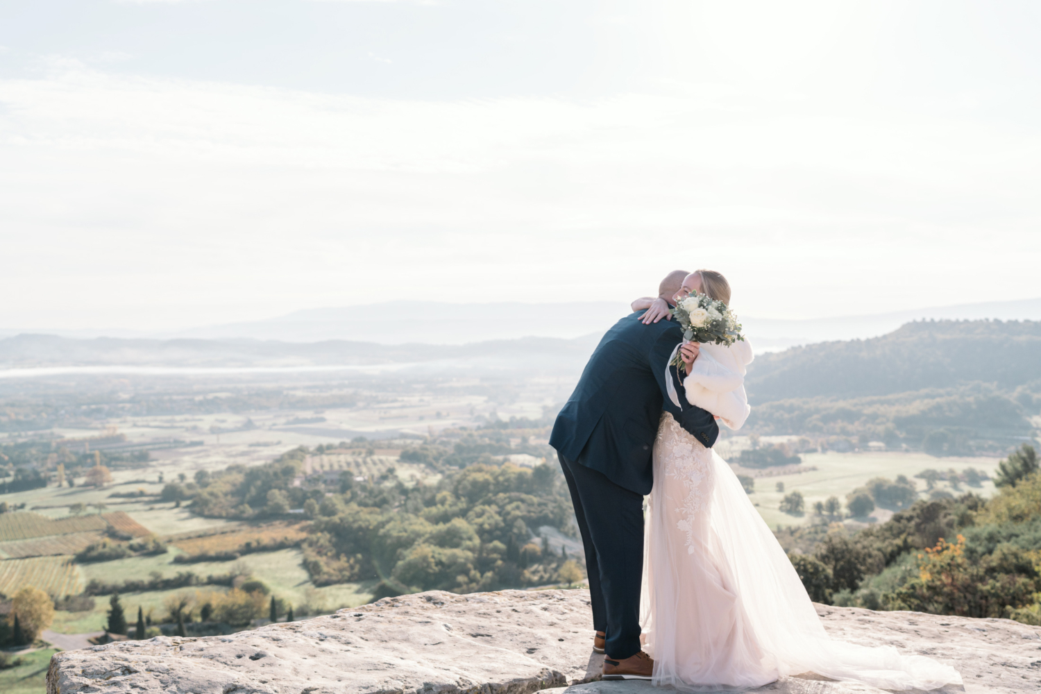 bride and groom hug after their first look in gordes france provence