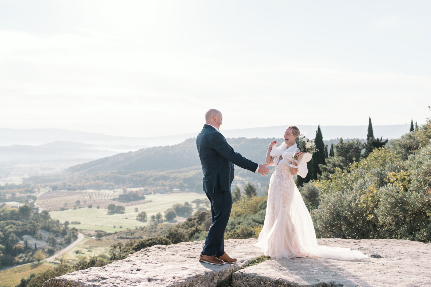 bride and groom are delighted to see each other during their first look in gordes france provence