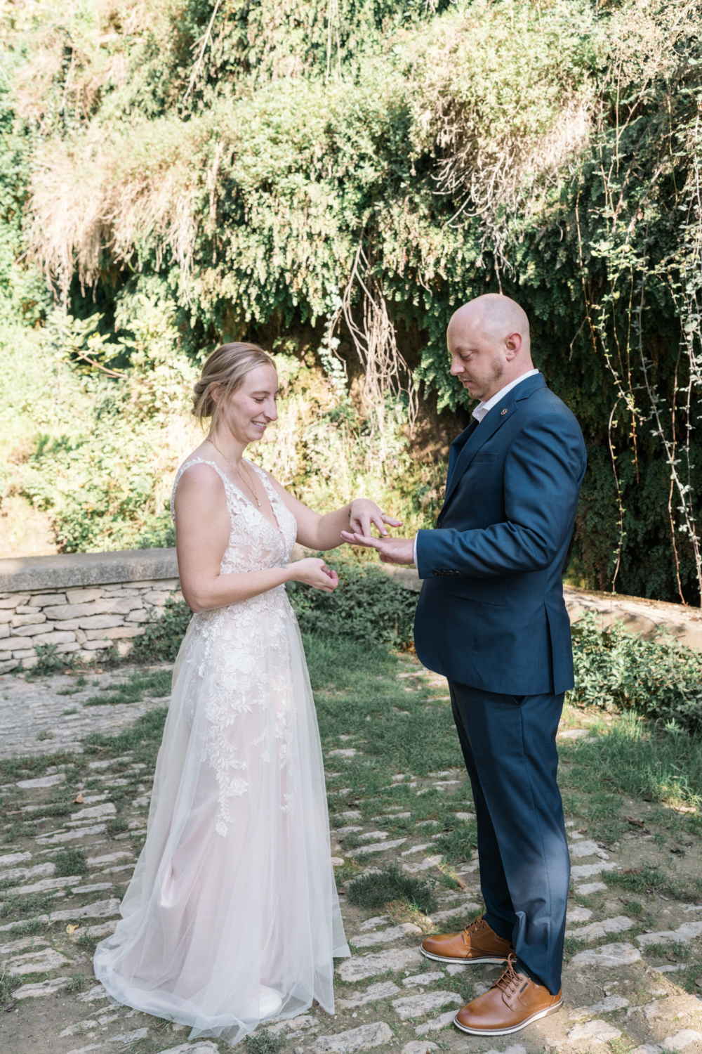 bride and groom exchange rings during their wedding in gordes france provence