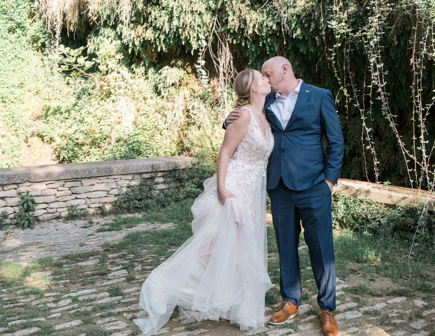 bride kisses groom after their wedding ceremony in gordes france provence