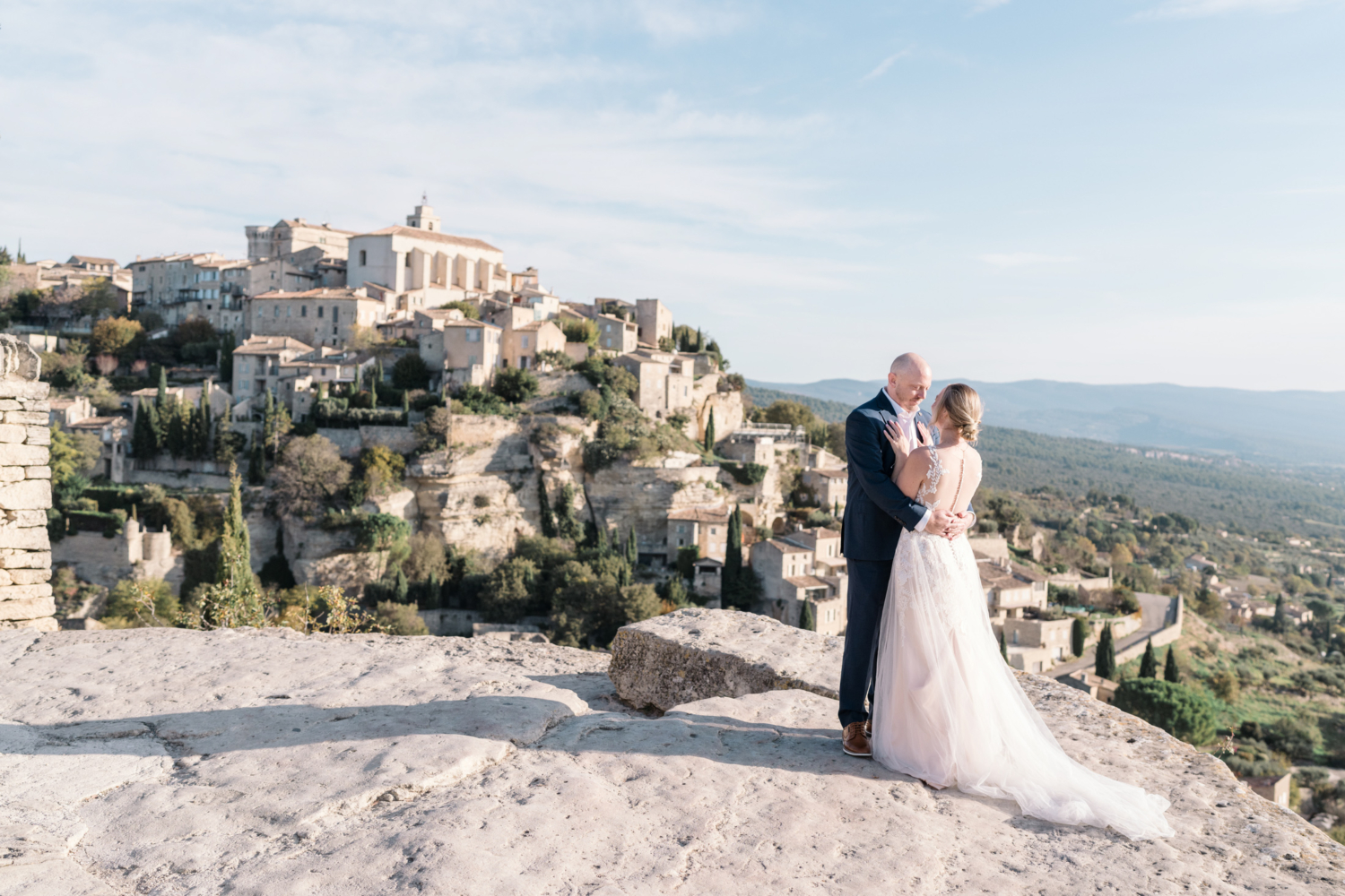 bride and groom embrace on their wedding day in gordes france provence