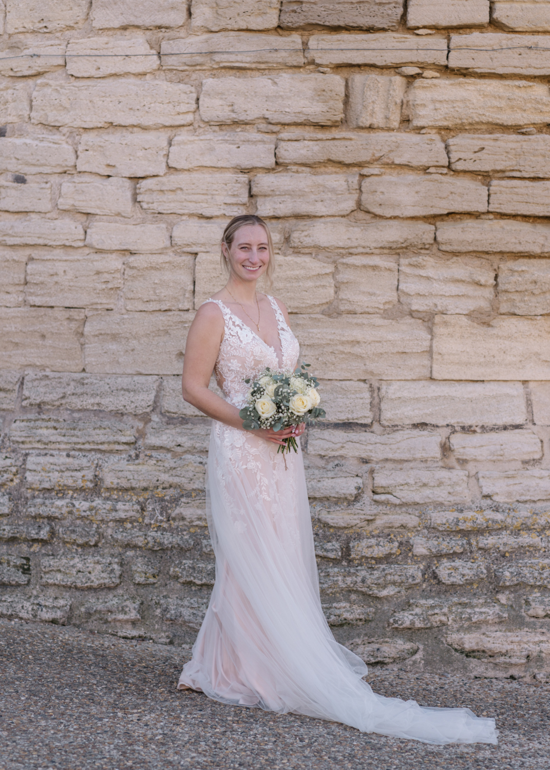 bride holds her bouquet of flowers in gordes france