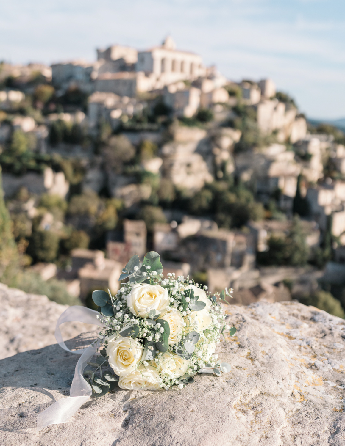 bridal bouquet with view of gordes france provence in background