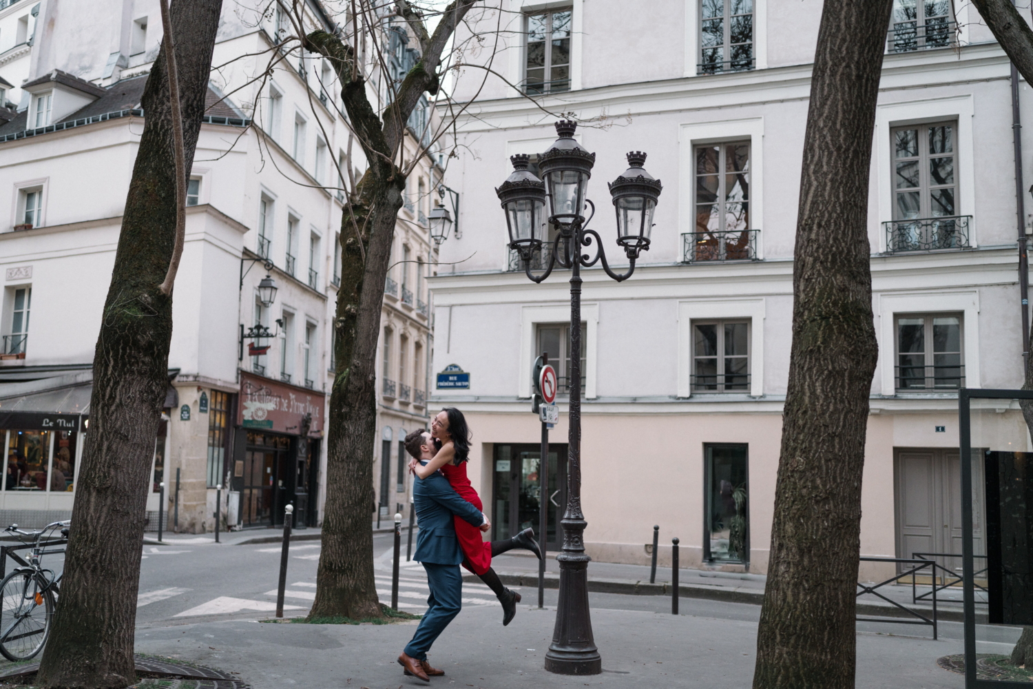 newly engaged couple dance in paris