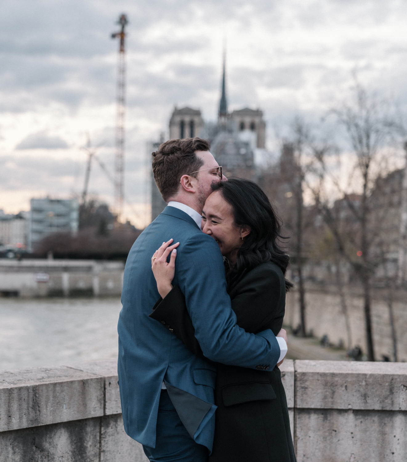 newly engaged couple embrace right after their proposal in paris