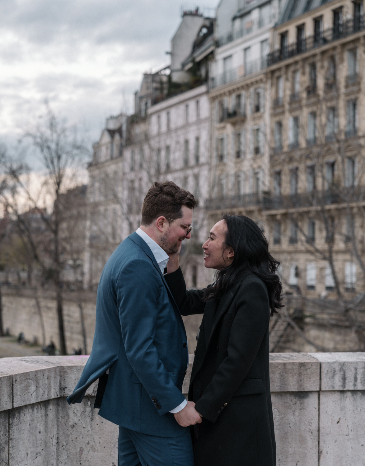 newly engaged couple look at each other in paris