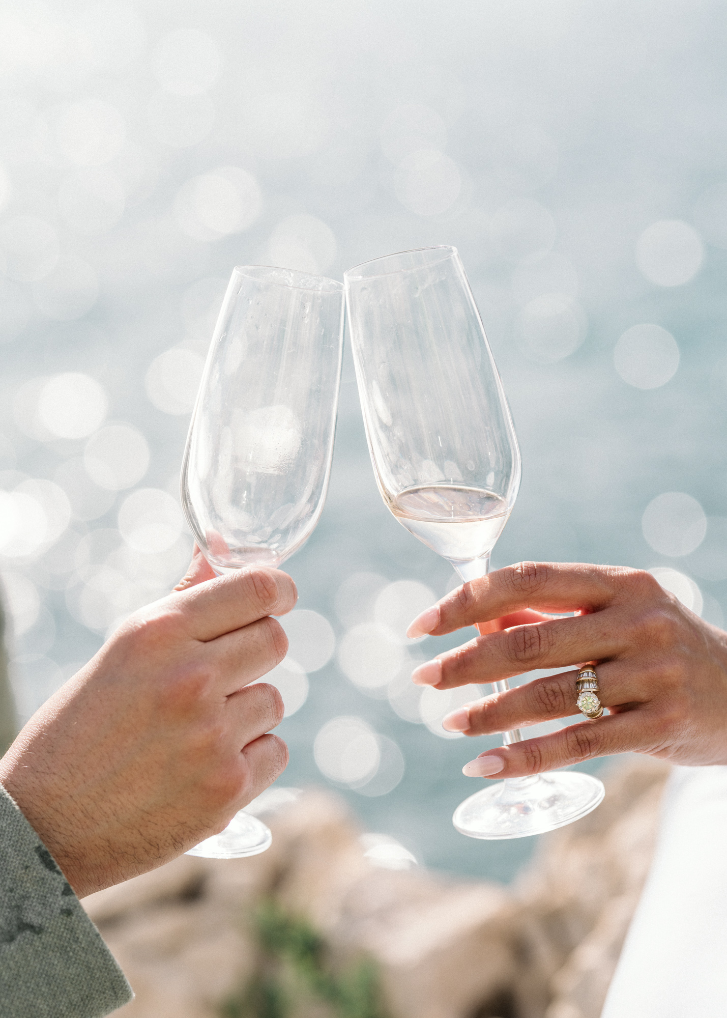 two people holding champagne glasses