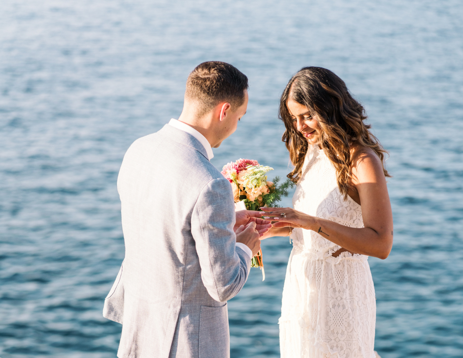 bride and groom exchange rings at the sea in saint jean cap ferrat france on the french riviera