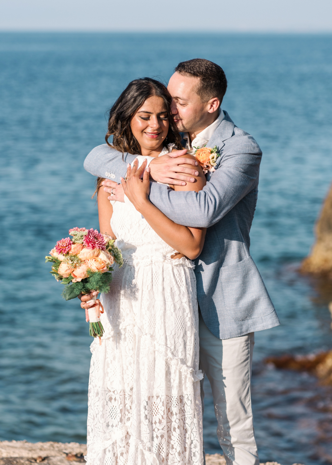 beautiful newlywed couple embrace with sea view in saint jean cap ferrat france