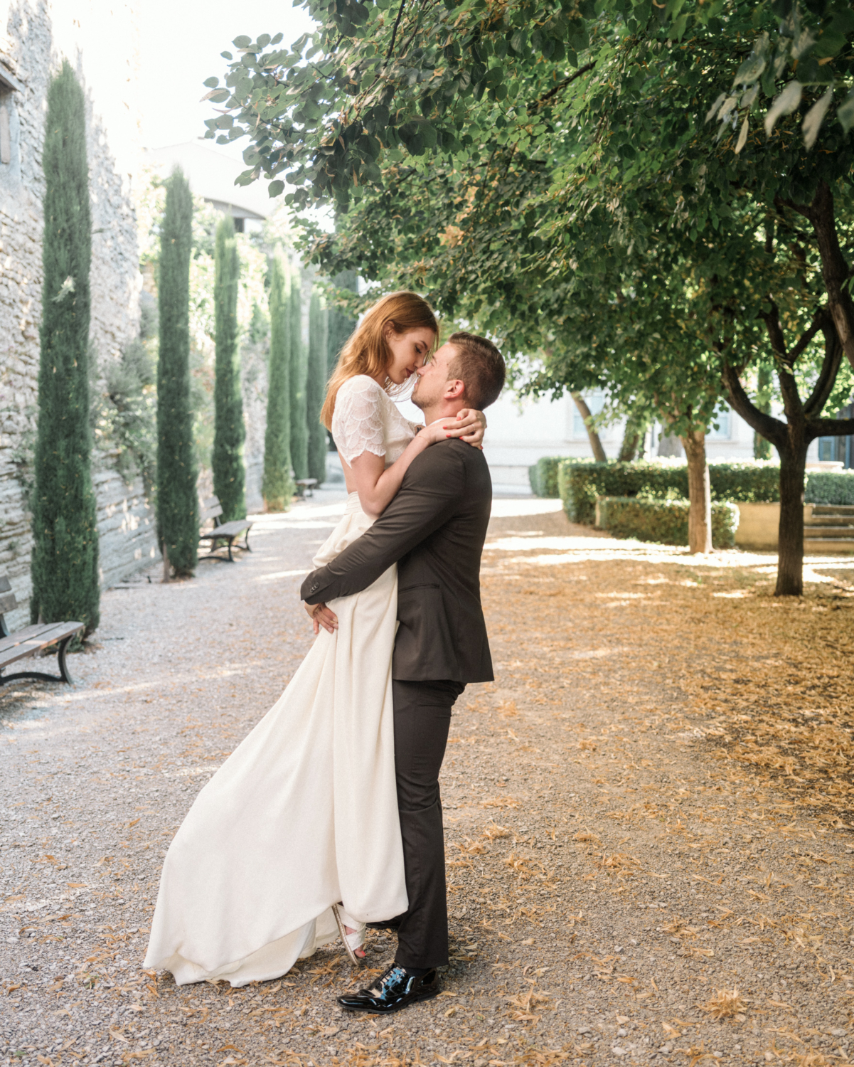 bride and groom dance in a garden in gordes france