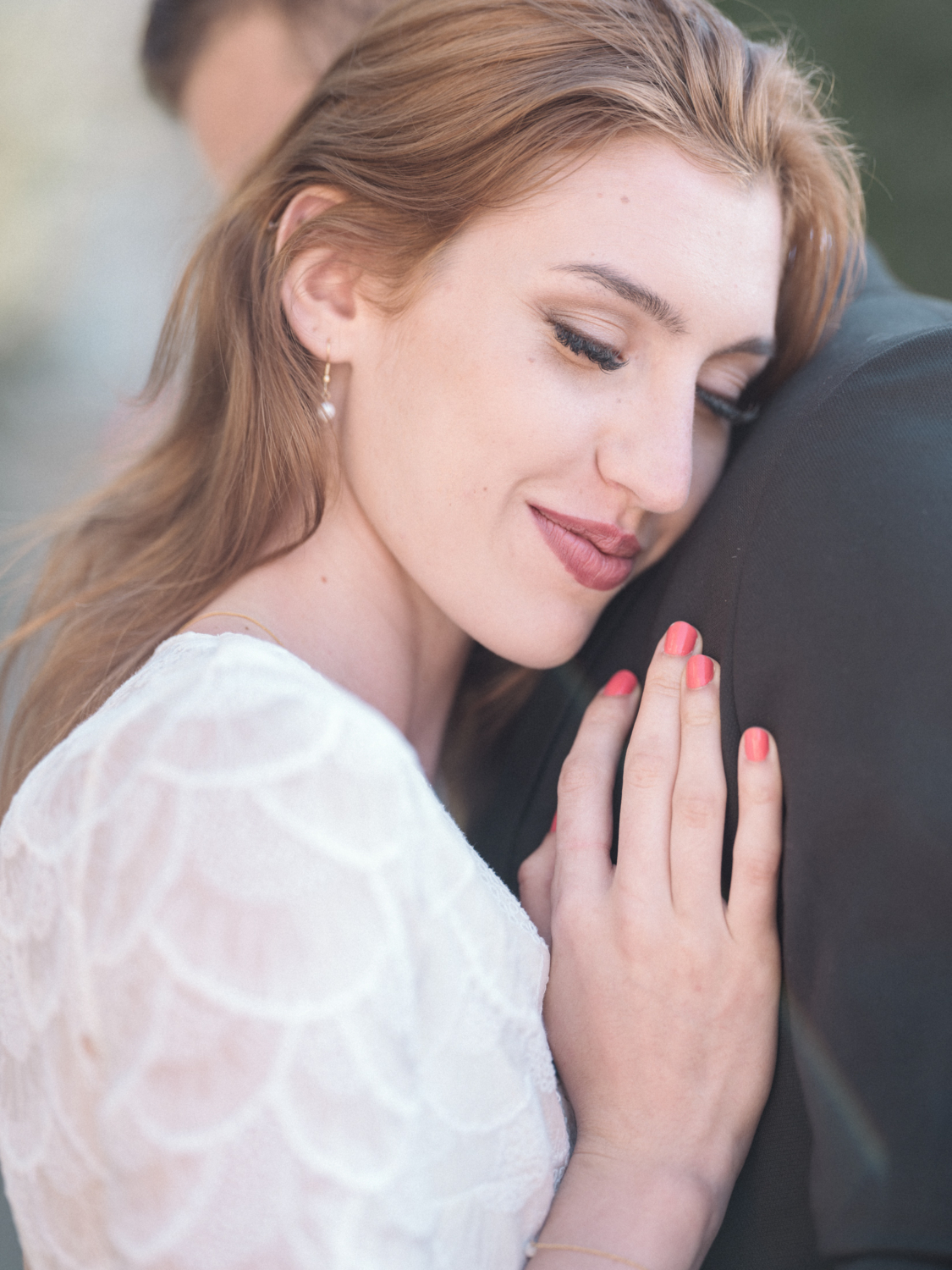 bride rests her head on groom's shoulder in gordes france