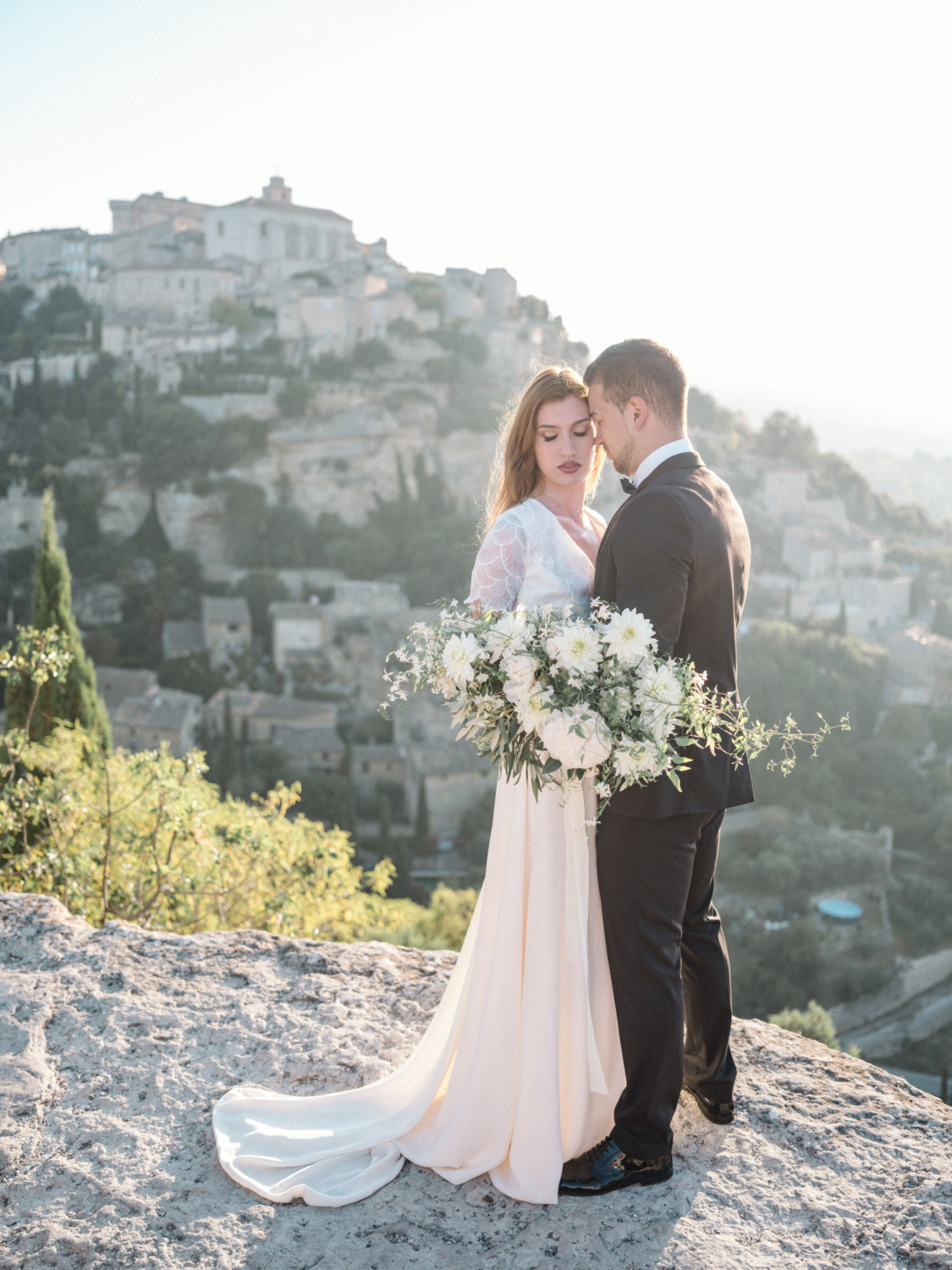 bride and groom hold each other passionately in gordes france