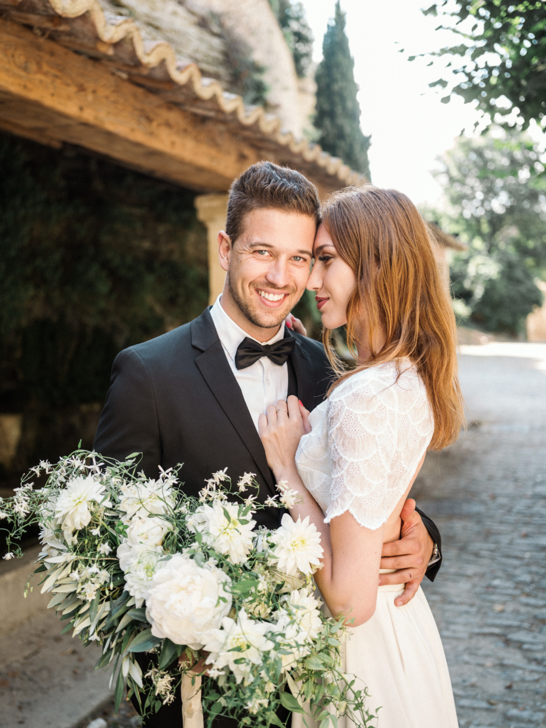 groom smiles on his wedding day in gordes france