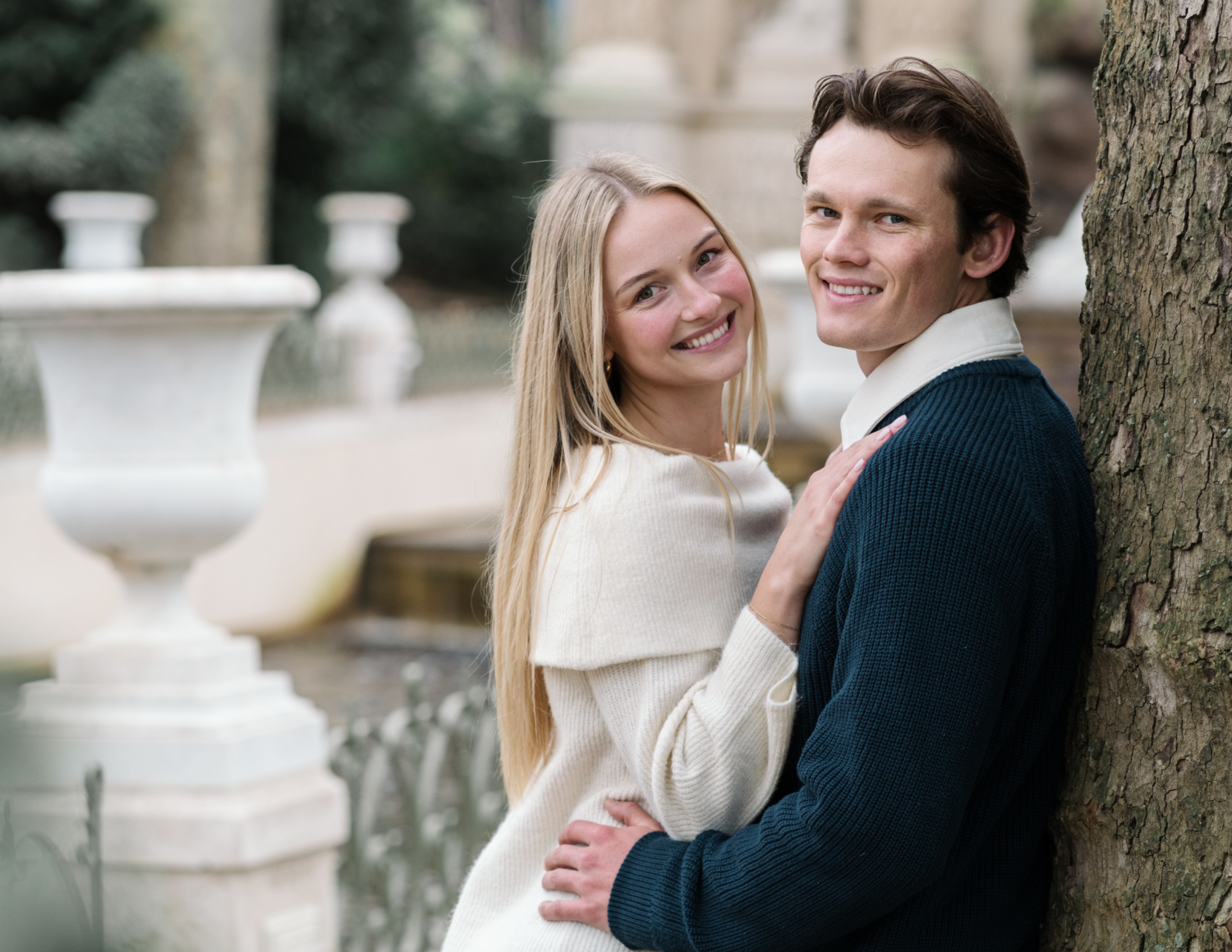 newly engaged couple smile during their engagement session in paris