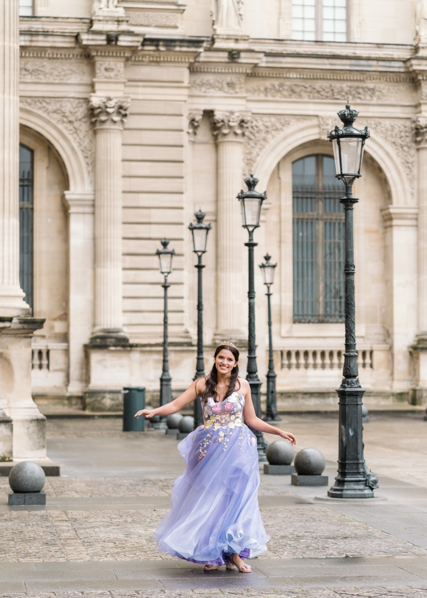 young woman smiles and has fun in paris during quinceanera photo session