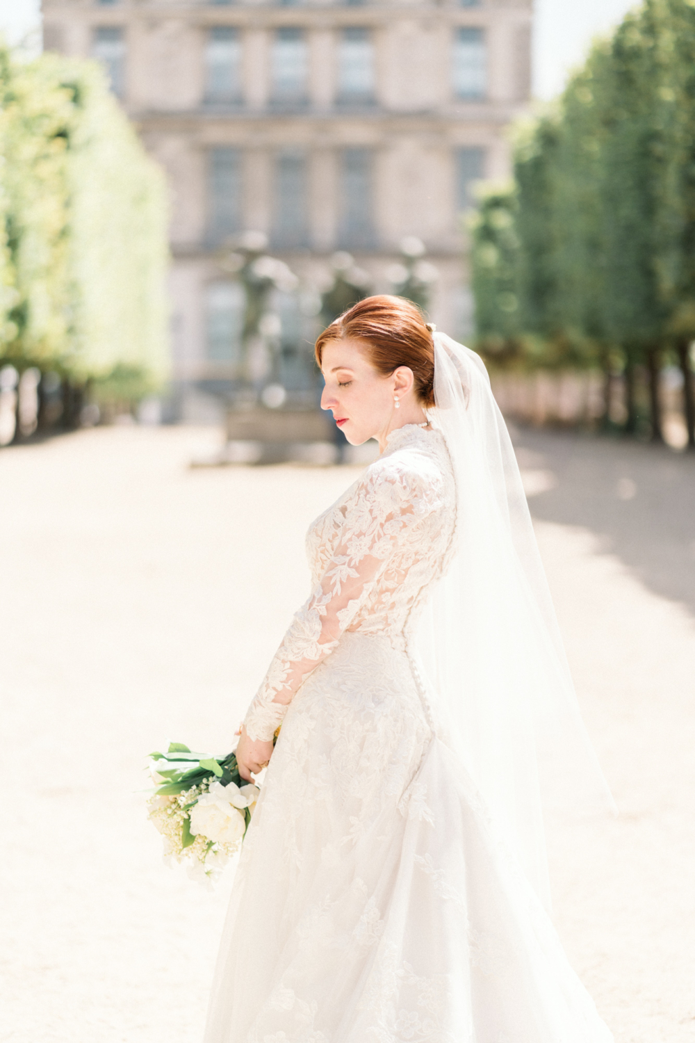 bride poses after her wedding in paris