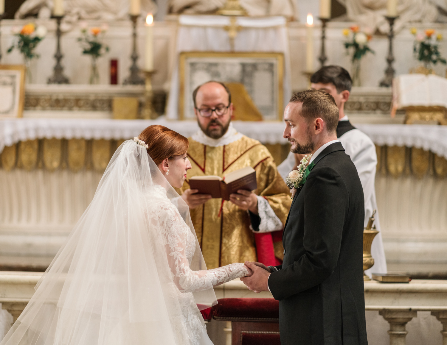 couple exchange vows at their wedding at eglise saint roch in paris