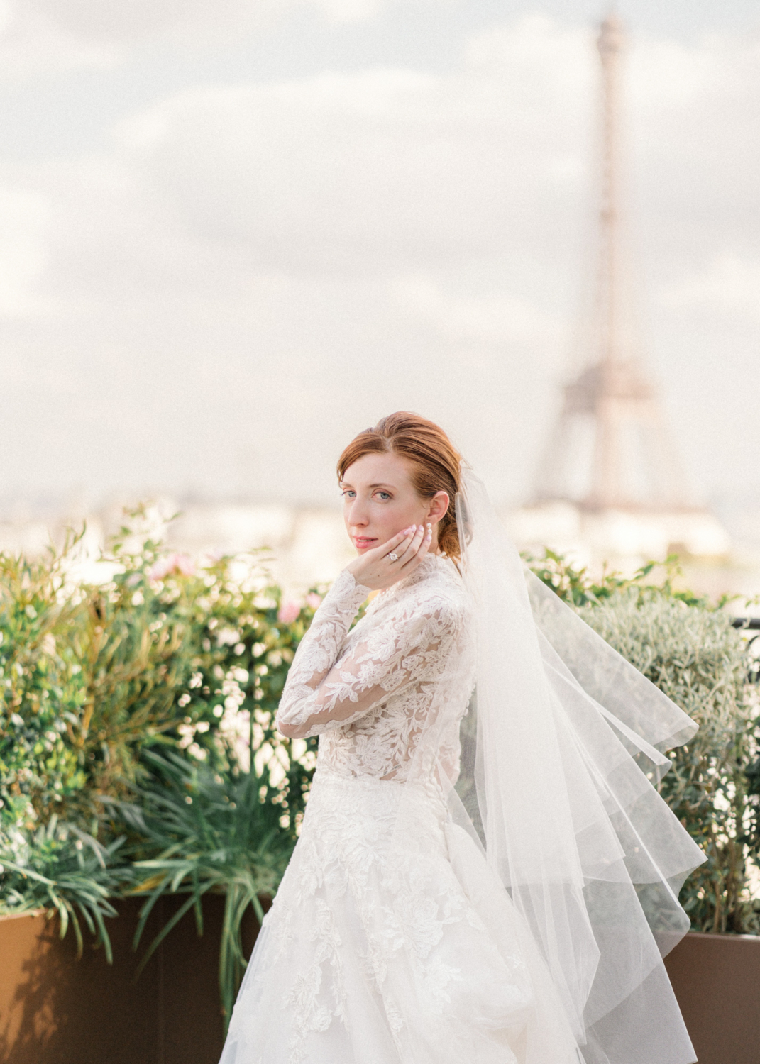bride poses in paris with eiffel tower behind her