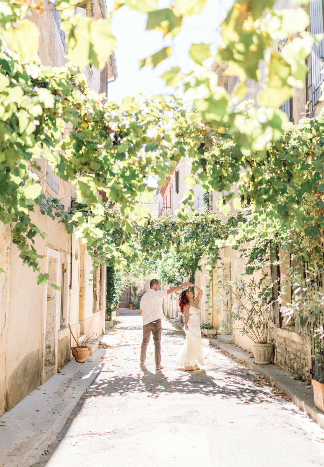 beautiful couple dances on a street in arles france