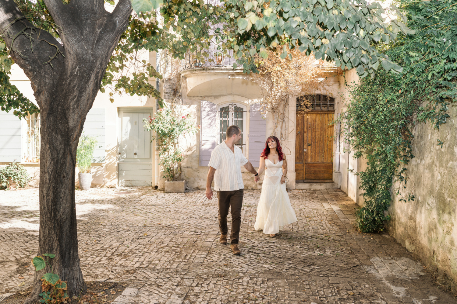 married couple walk together in arles france