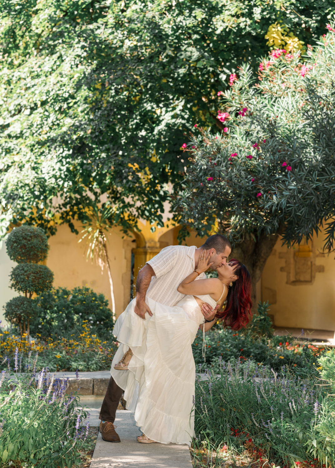 couple passionately kiss in arles garden