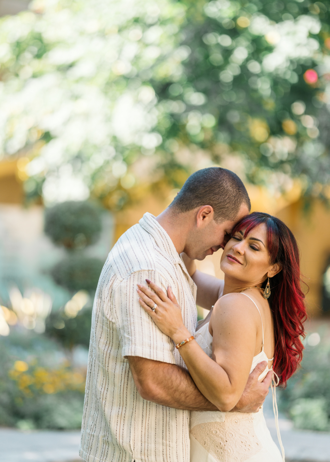 beautiful couple embrace in garden in arles france