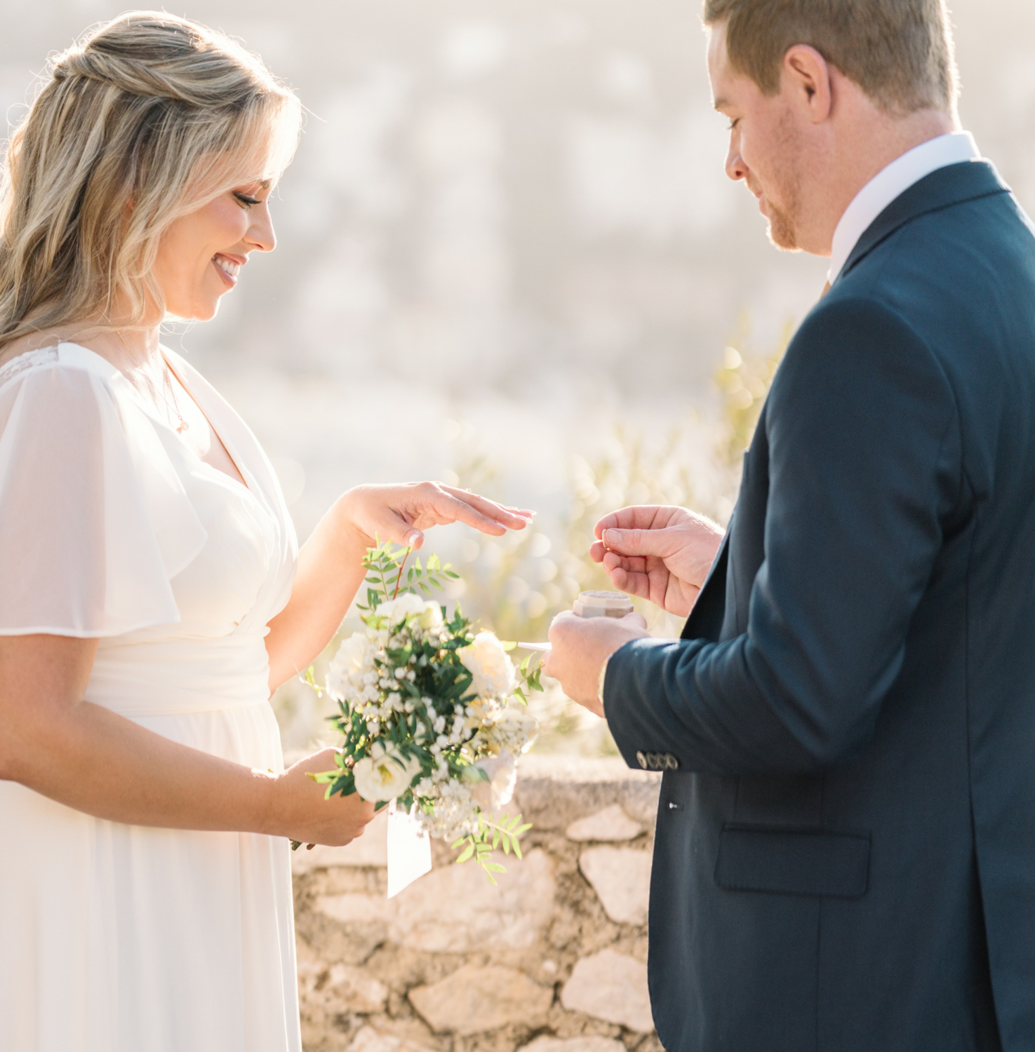 bride and groom exchange rings on their elopement day in nice france