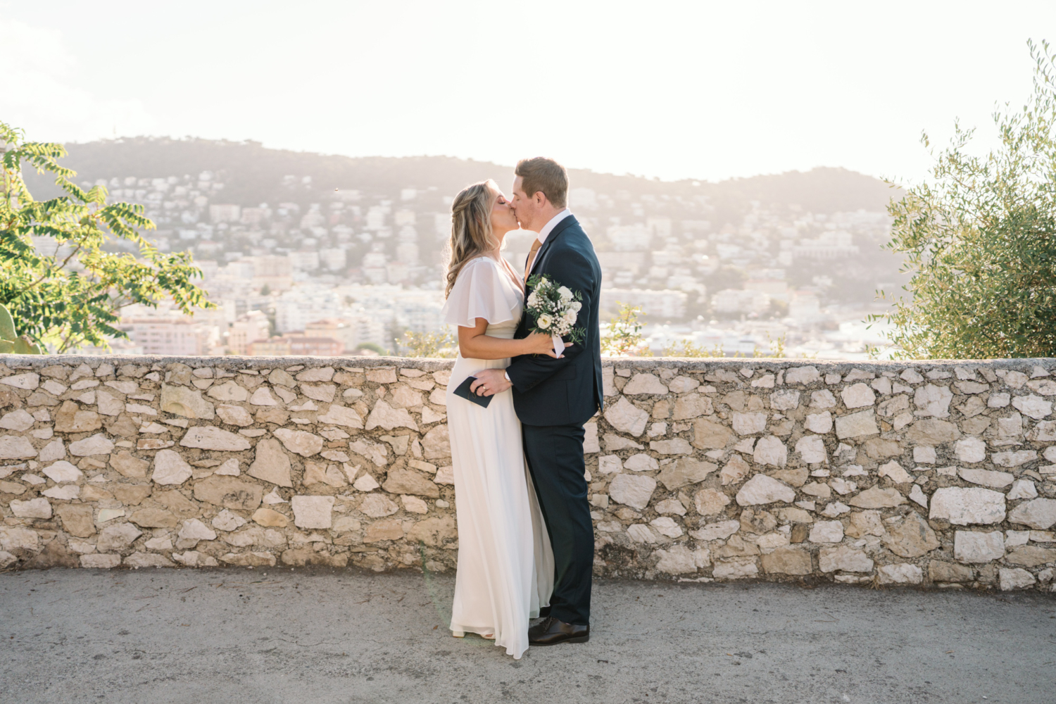 bride and groom kiss after their vow exchange in nice france