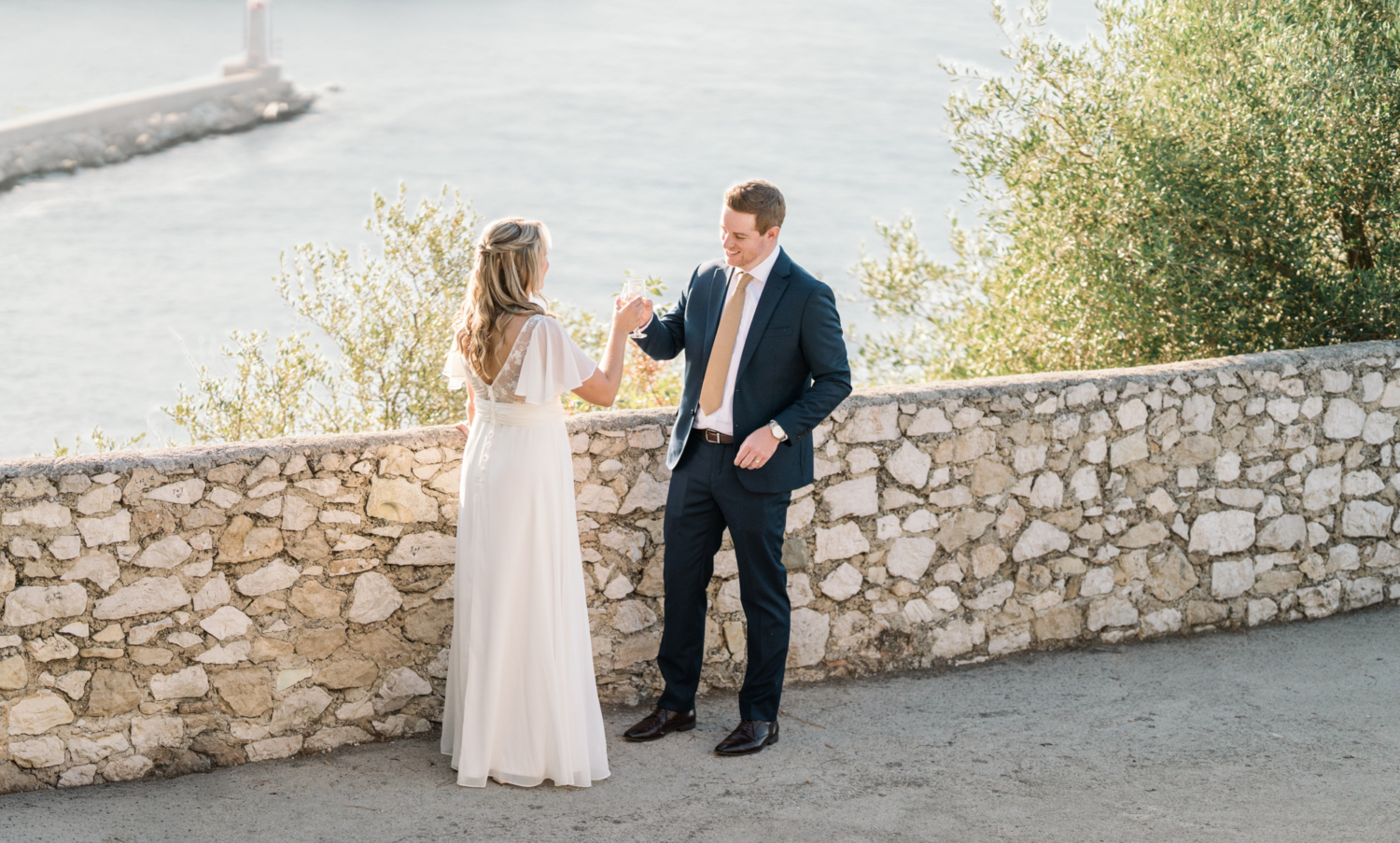 bride and groom toast each other after their elopement in nice france