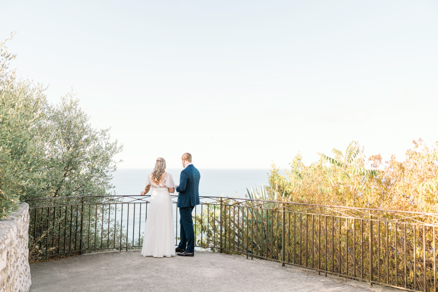 bride and groom view the sea after their elopement in nice france