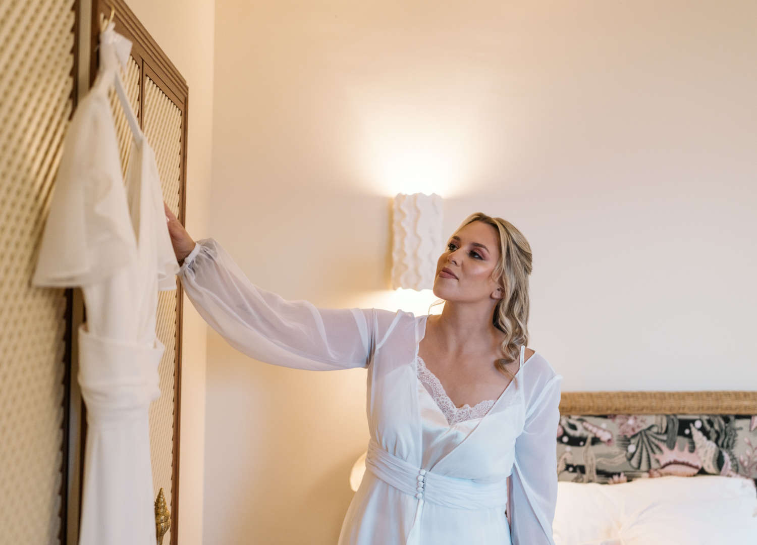 bride admires her wedding gown on her wedding day in nice france