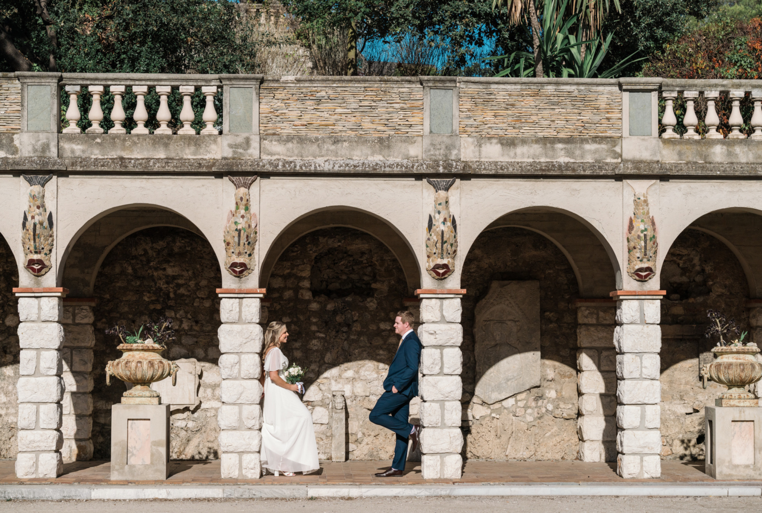 bride and groom pose in nice france