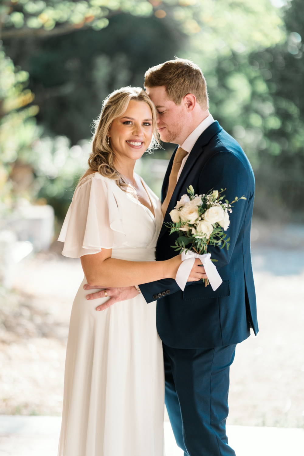 bride and groom pose on their wedding day in nice france