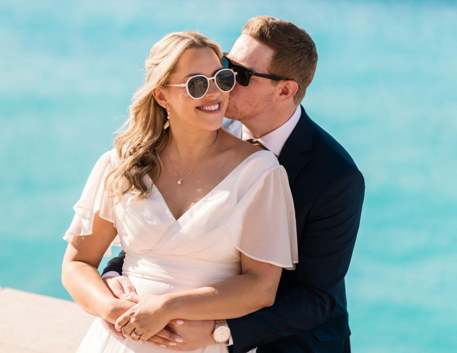 bride and groom pose in sunglasses in sunny nice france
