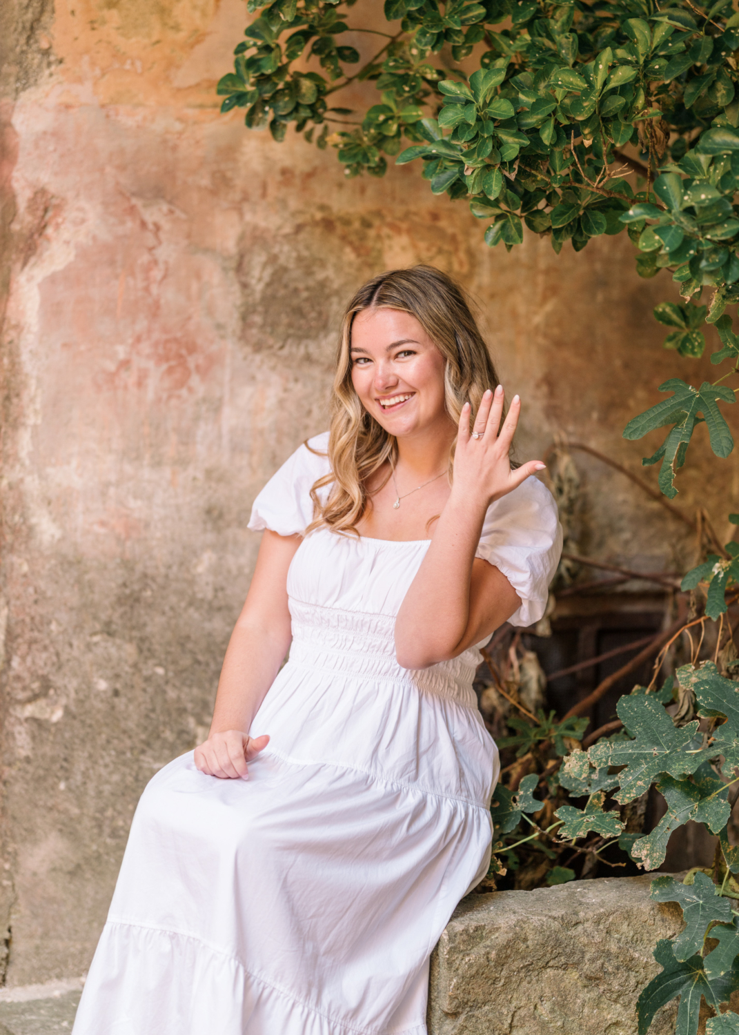 woman shows off her engagement ring in gordes provence france