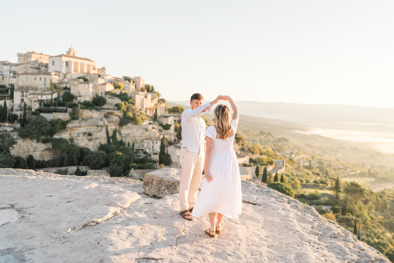 engaged couple dance in gordes, provence france